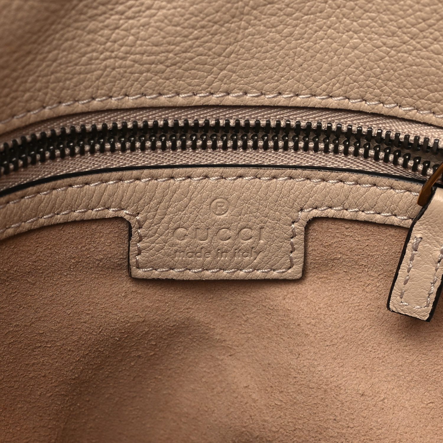 Close-up of the hardware and textured calfskin-style leather on the light beige Small Diana Shoulder Bag