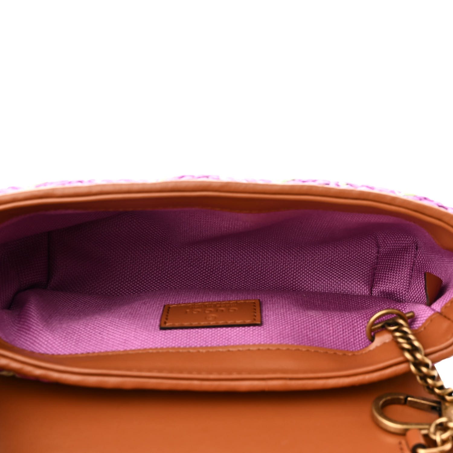 Interior view of the multicolor woven raffia Super Mini Shoulder Bag with compact storage