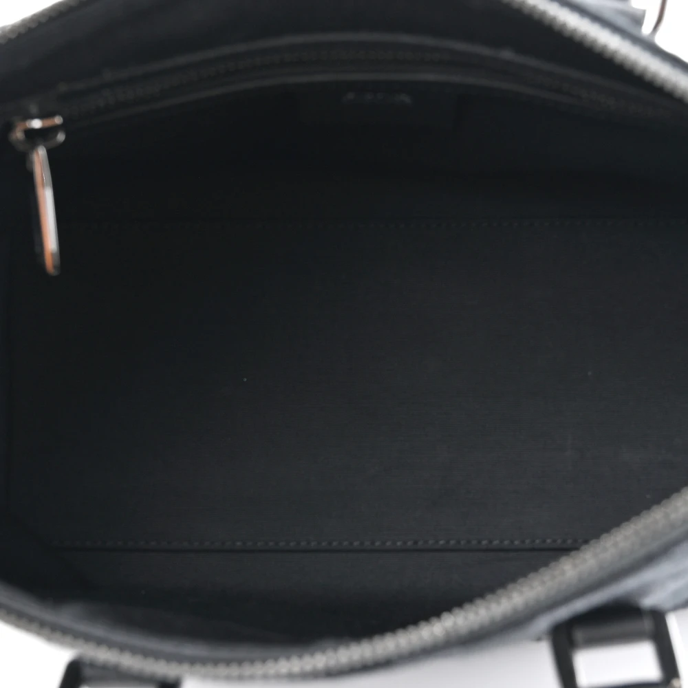 Interior view of the black D!0r Weekender 25 Bag with spacious storage compartments