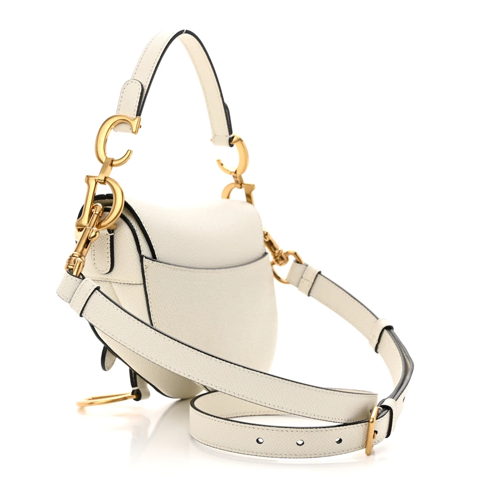 Back view of the white D!0r Saddle Bag with brass-tone accents