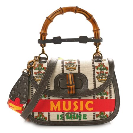 Front view of the printed beige canvas and chocolate brown calfskin Bamboo 1947 Medium Top Handle Bag