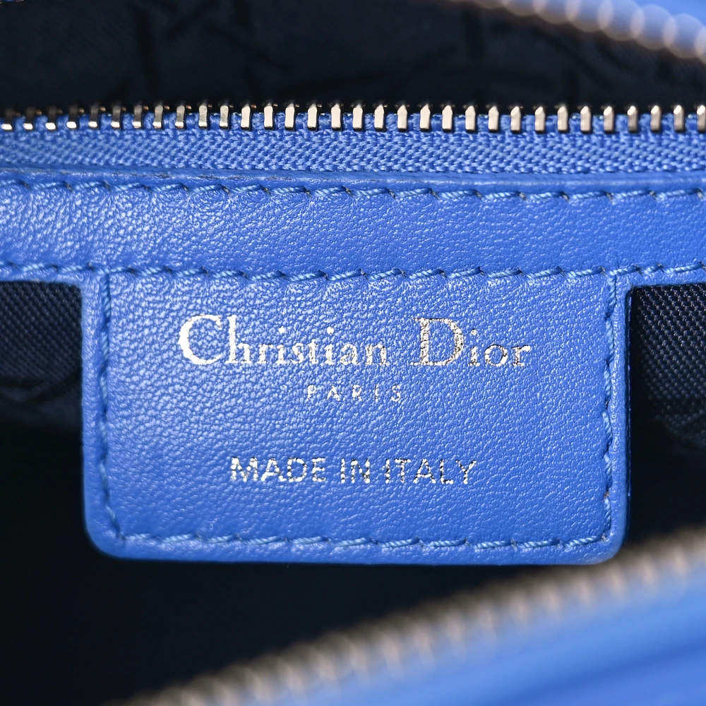 Close-up of the silver-tone D.I.O.R. charms and Cannage quilting on the horizon blue Lady D!0r