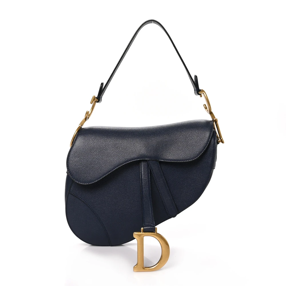 Front view of the navy blue grained calfskin D!0r Saddle Bag with its iconic curved silhouette