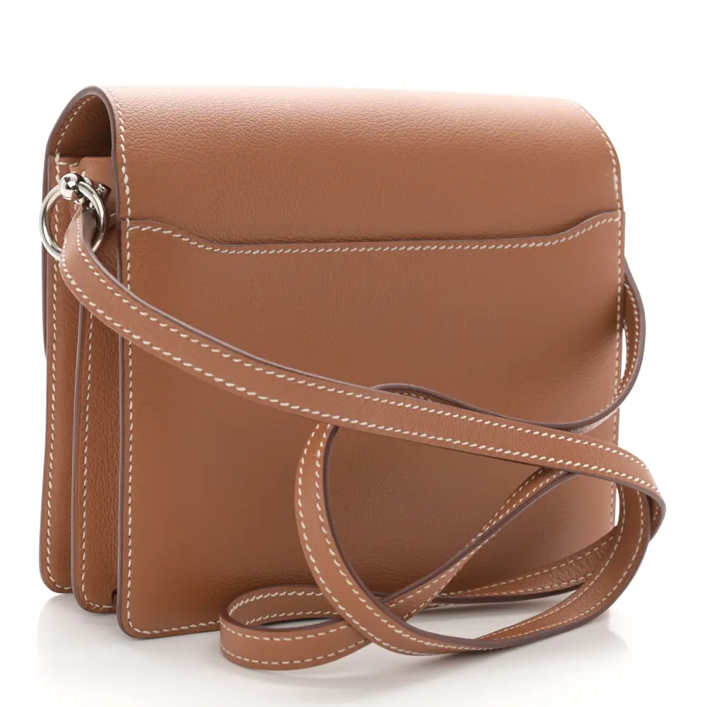 Back view of the brown Evercolor leather Herme$ Mini Sac Roulis