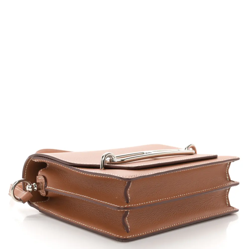 Bottom view of the brown Evercolor leather Herme$ Mini Sac Roulis