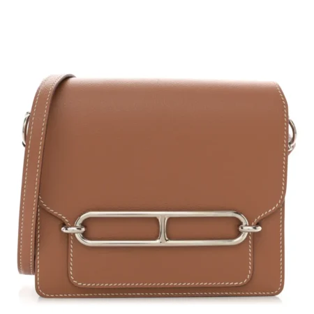 Front view of the brown Evercolor leather Herme$ Mini Sac Roulis