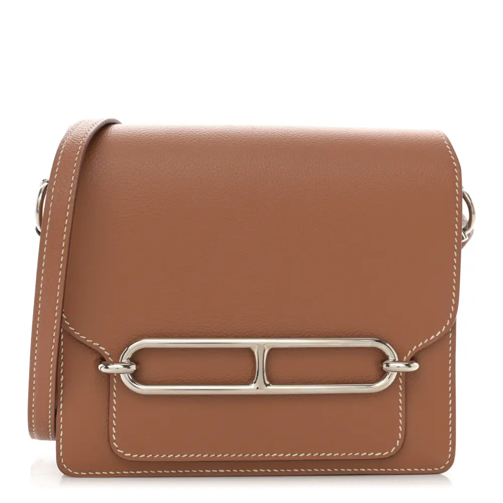 Front view of the brown Evercolor leather Herme$ Mini Sac Roulis