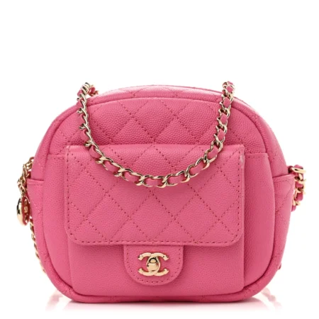 Front view of the vibrant pink quilted caviar Ch@nel camera case with gold-tone chain strap