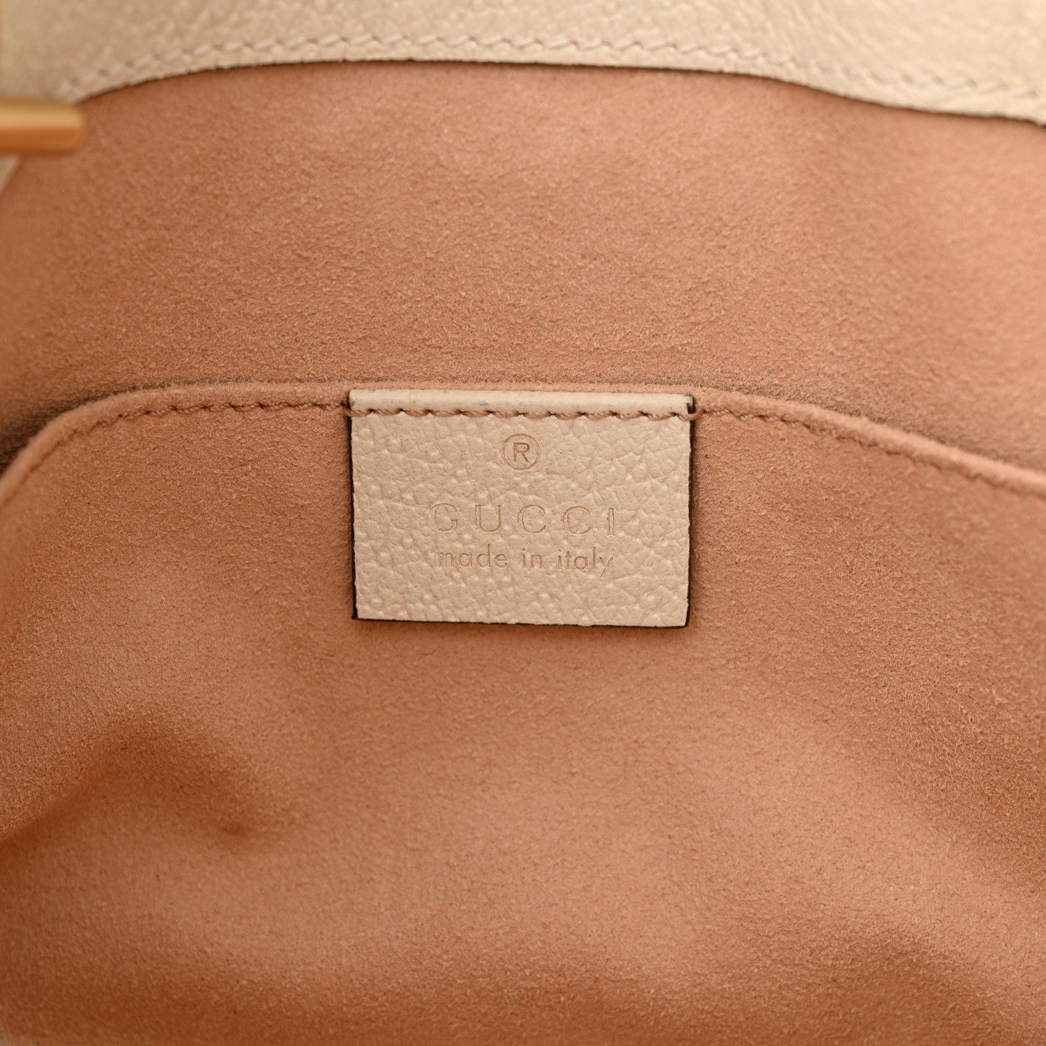 Close-up of the gold-tone padlock closure and aged gold-tone hardware on the Gucc! Flora Tote
