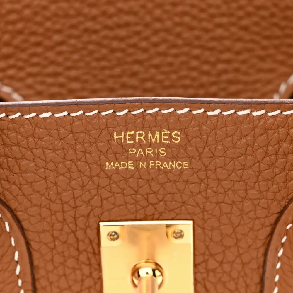 Close-up of the gold-tone lock, keys, clochette, and hardware on the Brown Togo Birkin 25