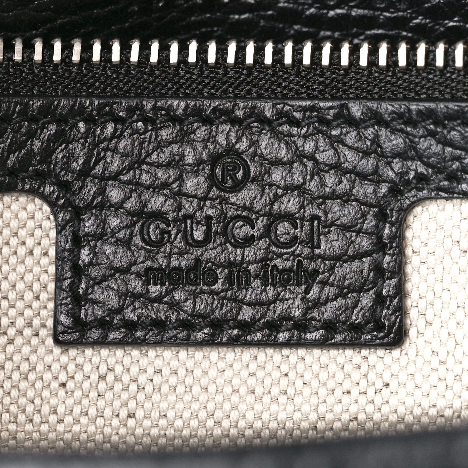 Close-up of the Gucc! Dionysus logo and silver-tone clasp detailing on the black calfskin crossbody bag