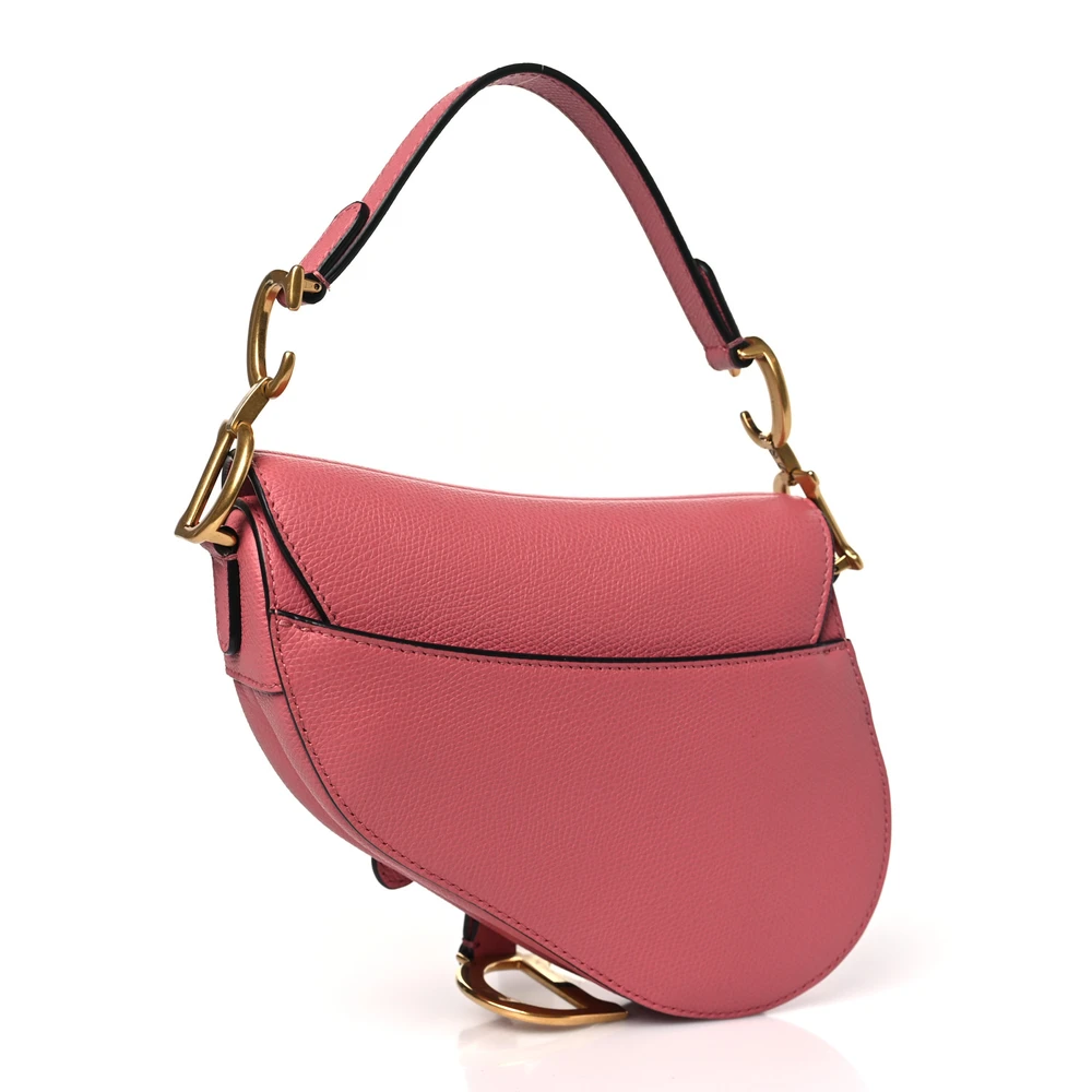 Back view of the pink grained calfskin D!0r Mini Saddle Bag with iconic curved Saddle silhouette