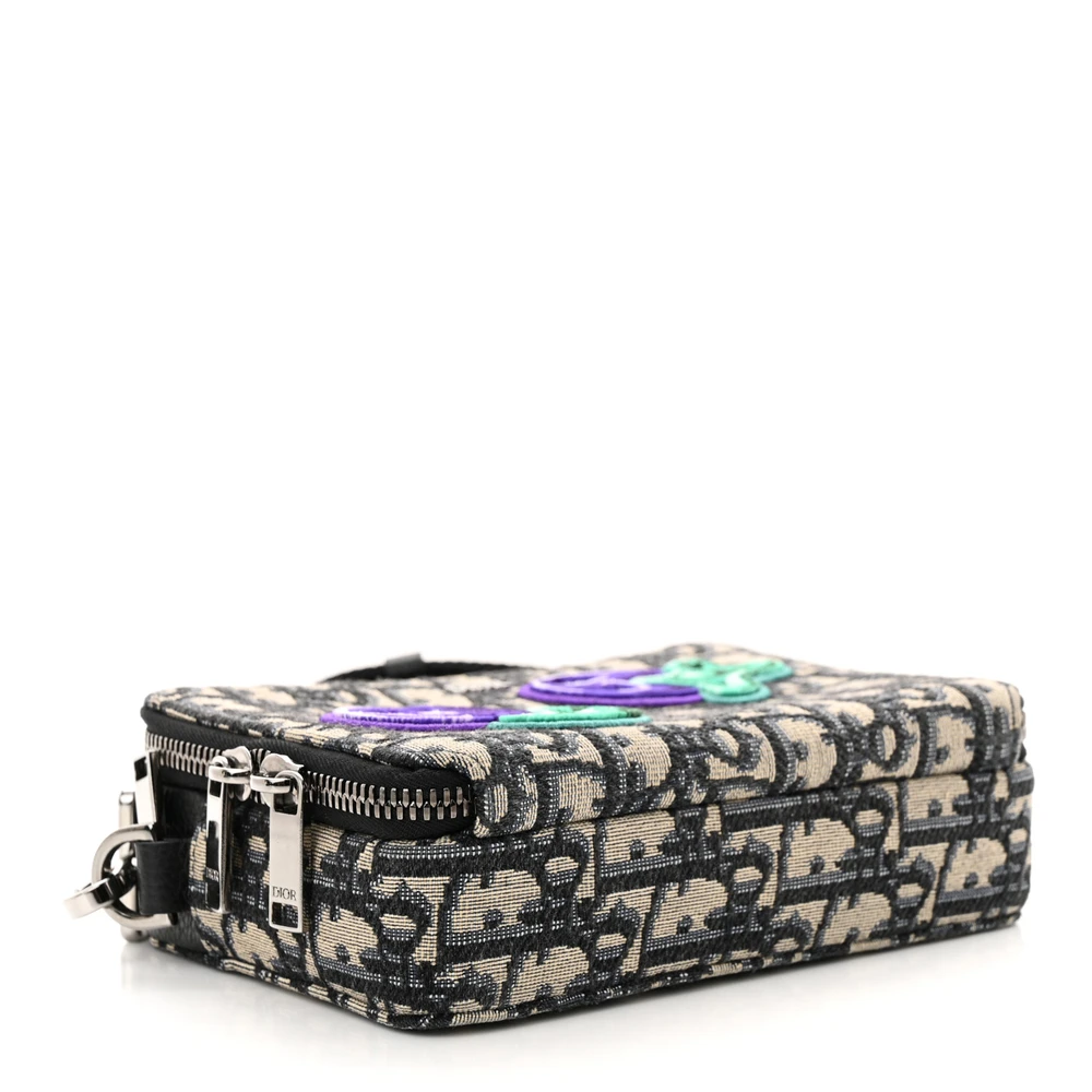 Bottom view of the charcoal D!0r x Kenny Scharf Crossbody Bag with colourful embroidered patches