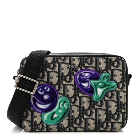 Front view of the charcoal D!0r x Kenny Scharf Crossbody Bag with colourful embroidered patches
