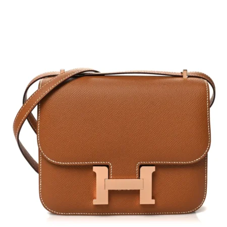 Front view of the brown Epsom leather Herme$ Constance 18 shoulder bag