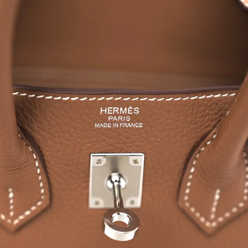Close-up of the palladium-tone hardware, padlock, keys, and leather clochette on the Brown Togo Birkin 25