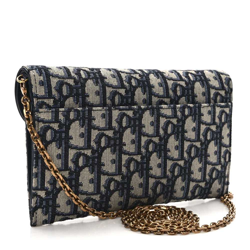 Back view of the blue Oblique monogram canvas D!0r Saddle Chain Long Wallet