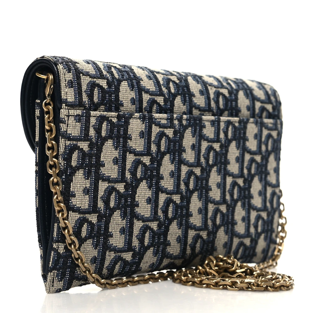Back view of the blue and beige D!0r Saddle Chain Long Wallet with Saddle-style crossover flap