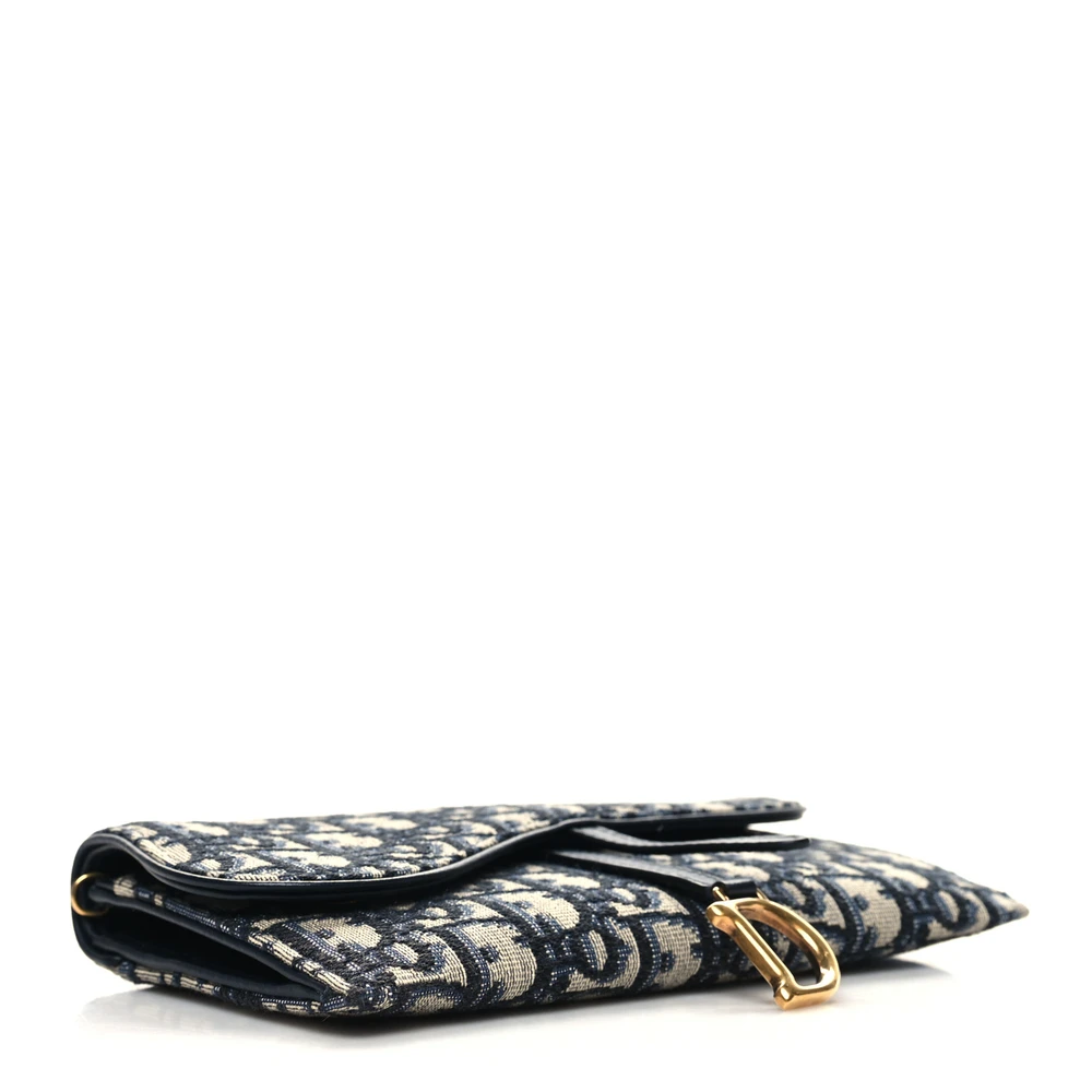 Bottom view of the blue and beige D!0r Saddle Chain Long Wallet with Saddle-style crossover flap