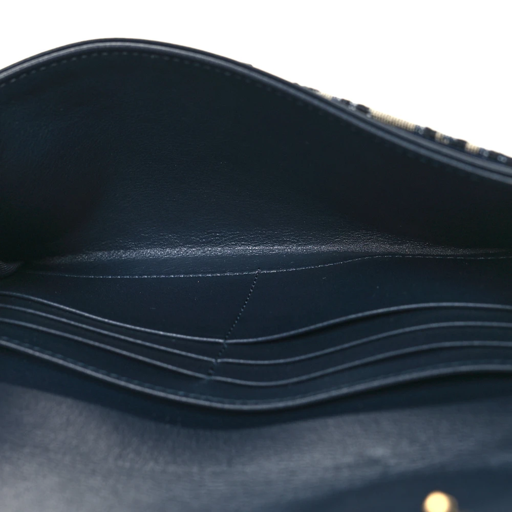 Interior view of the D!0r Saddle Chain Long Wallet with card slots, compartments, and zip pocket