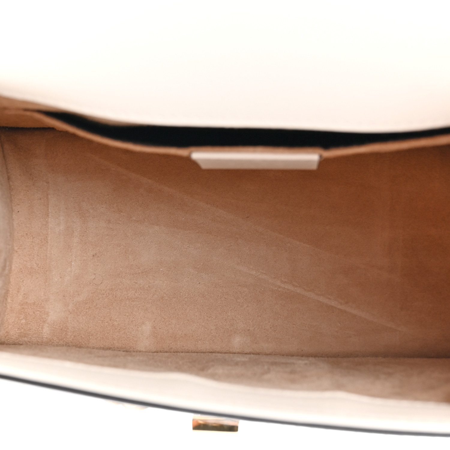 Interior view of the white Gucc! Mini Sylvie Top Handle Bag with its main compartment