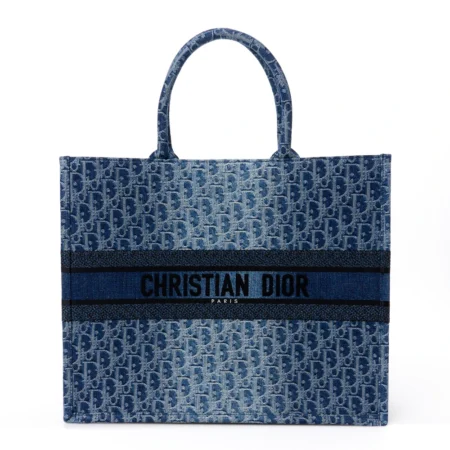 Front view of the blue Oblique denim D!0r Large Book Tote