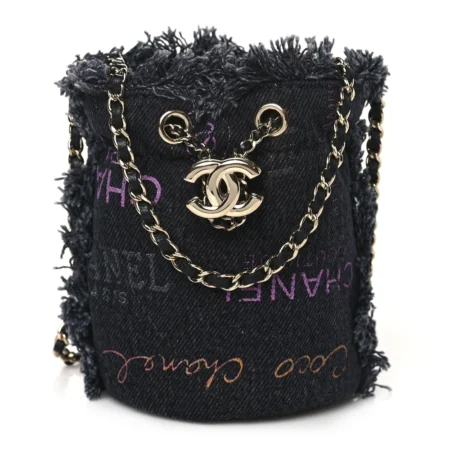 Front view of the black denim Ch@nel Mood Mini Bucket Bag with leather-threaded gold-tone chain and CC emblem