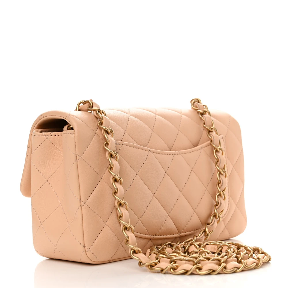 Front view of the beige Ch@nel quilted Mini Flap with lambskin leather and gold-tone chain strap