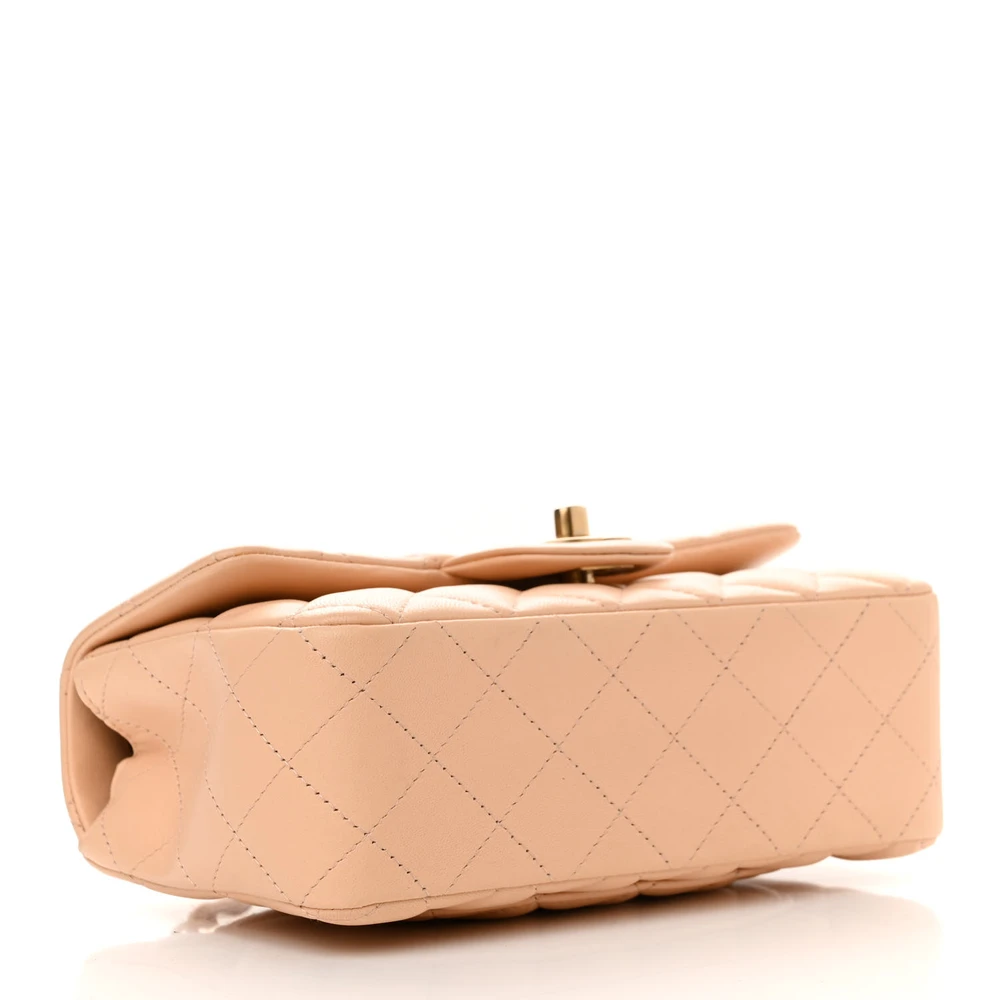 Front view of the beige Ch@nel quilted Mini Flap with lambskin leather and gold-tone chain strap