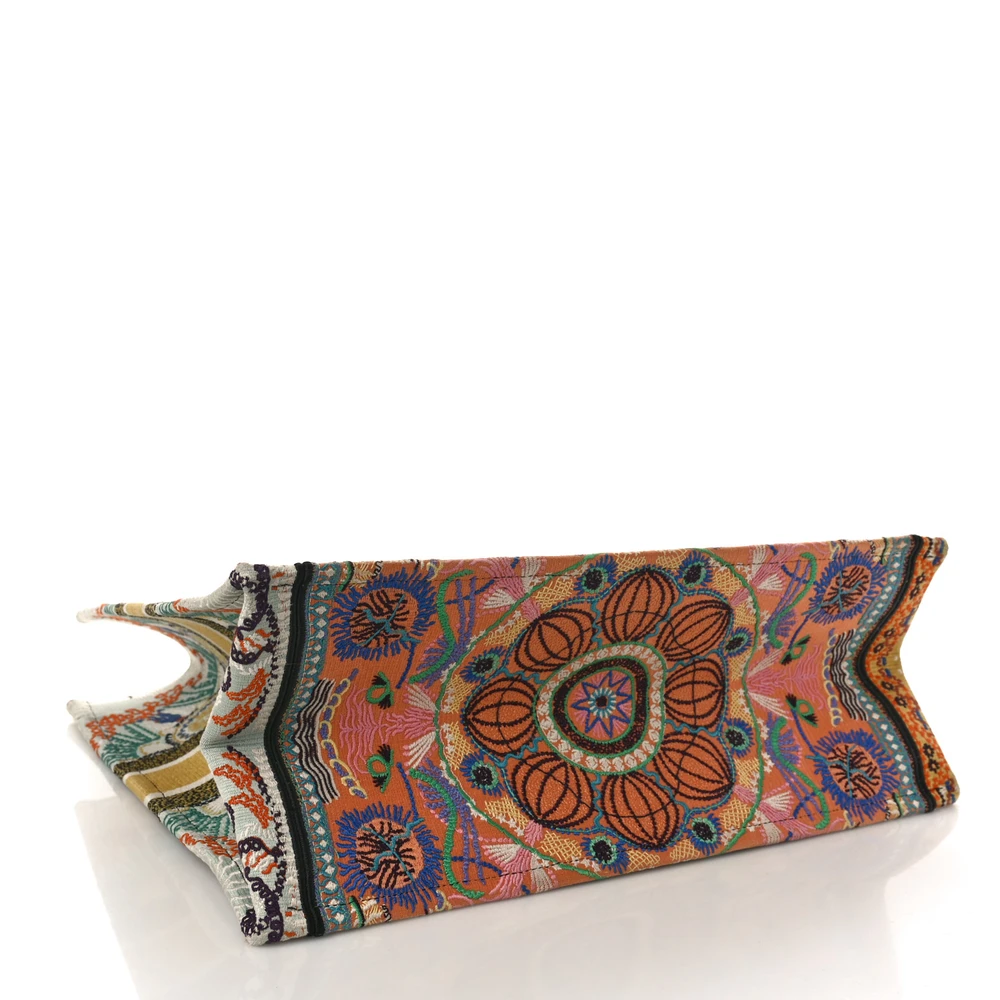Bottom view of the D!0r large book Tote multicolor embroidered canvas with intricate vibrant designs