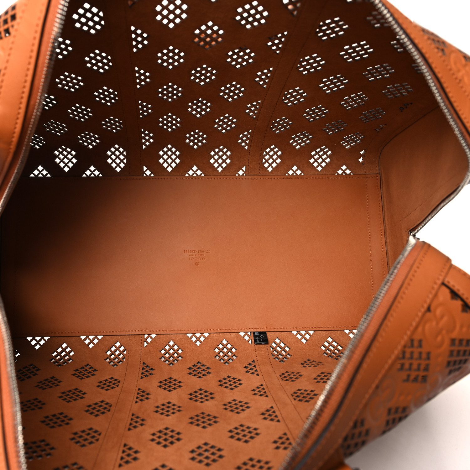 Interior view of the harness brown Gucc! Medium Duffle Bag showing its spacious main compartment and pockets