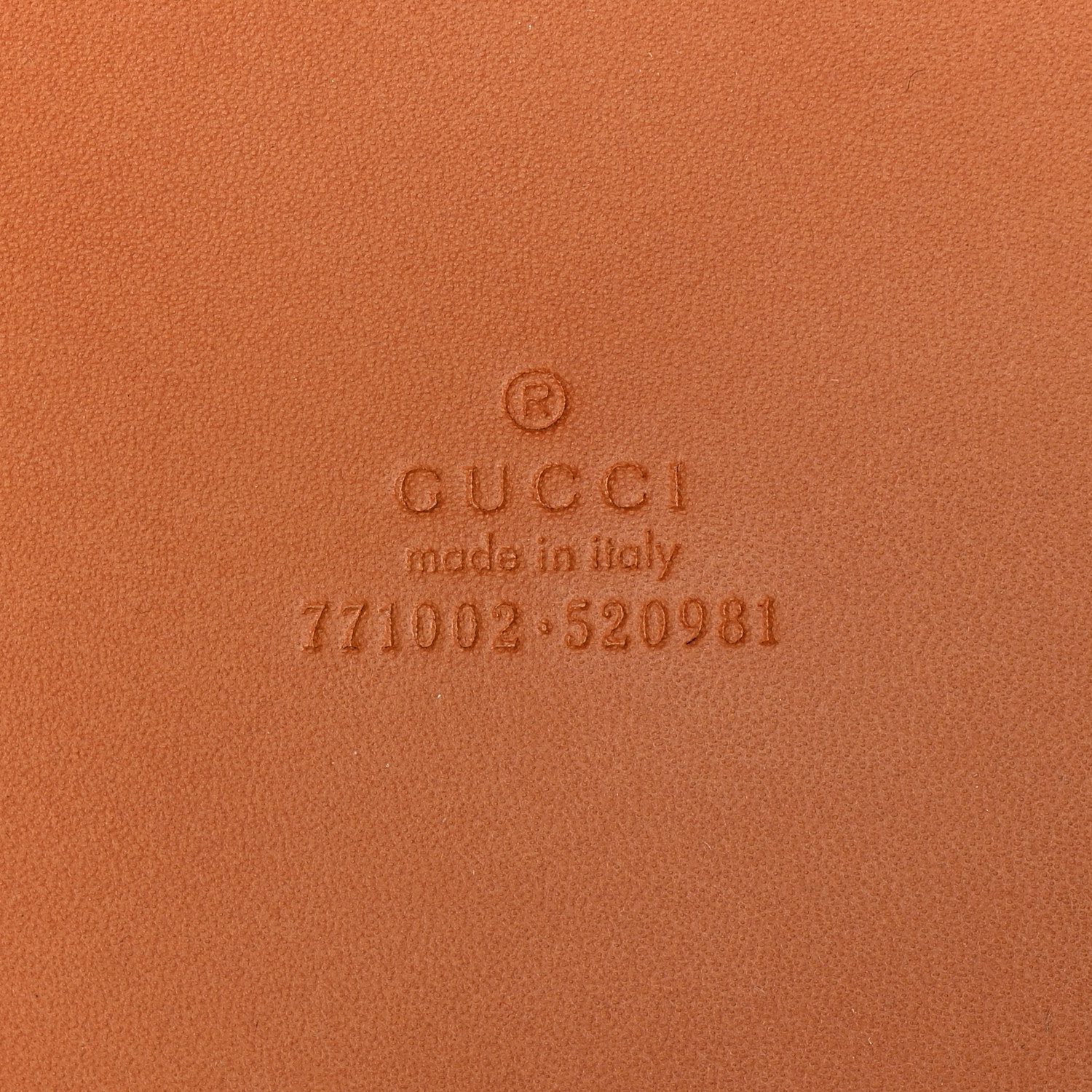 Close-up of the GG embossed detailing and diamond cut-out motif on the harness brown Gucc! Duffle Bag