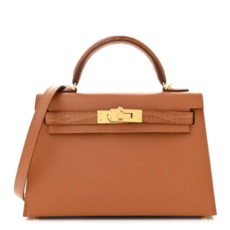 Front view of the brown Herme$ Mini Kelly Sellier Touch 20 with gold-tone hardware
