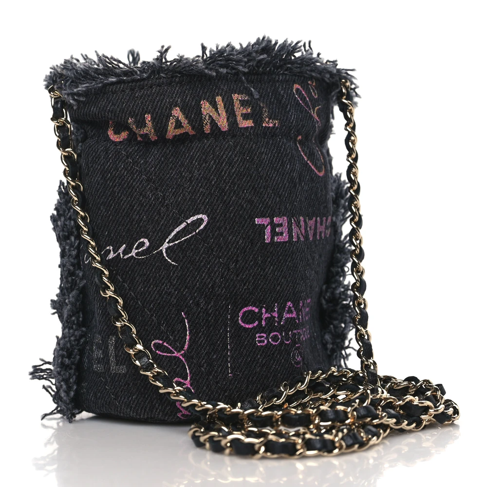 Back view of the black denim Ch@nel Mood Mini Bucket Bag with leather-threaded gold-tone chain and CC emblem