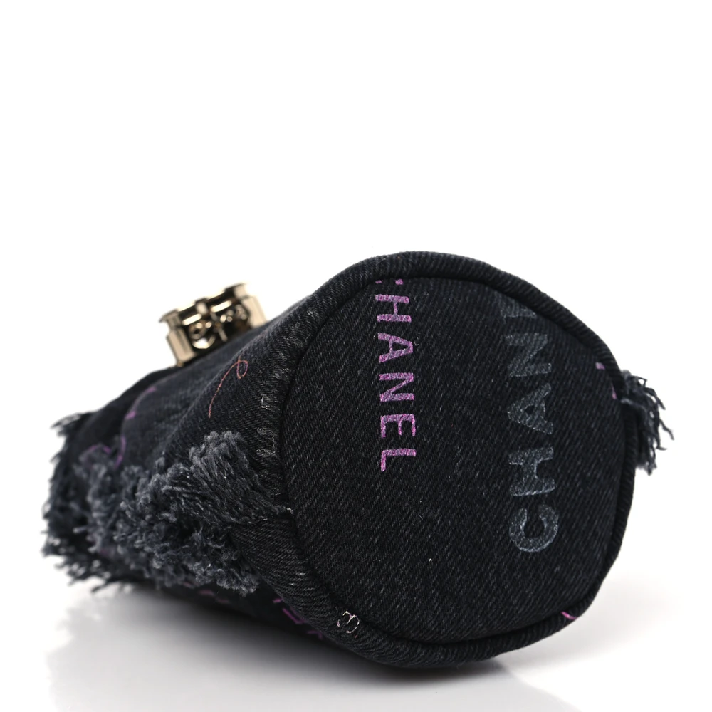 Bottom view of the black denim Ch@nel Mood Mini Bucket Bag with leather-threaded gold-tone chain and CC emblem