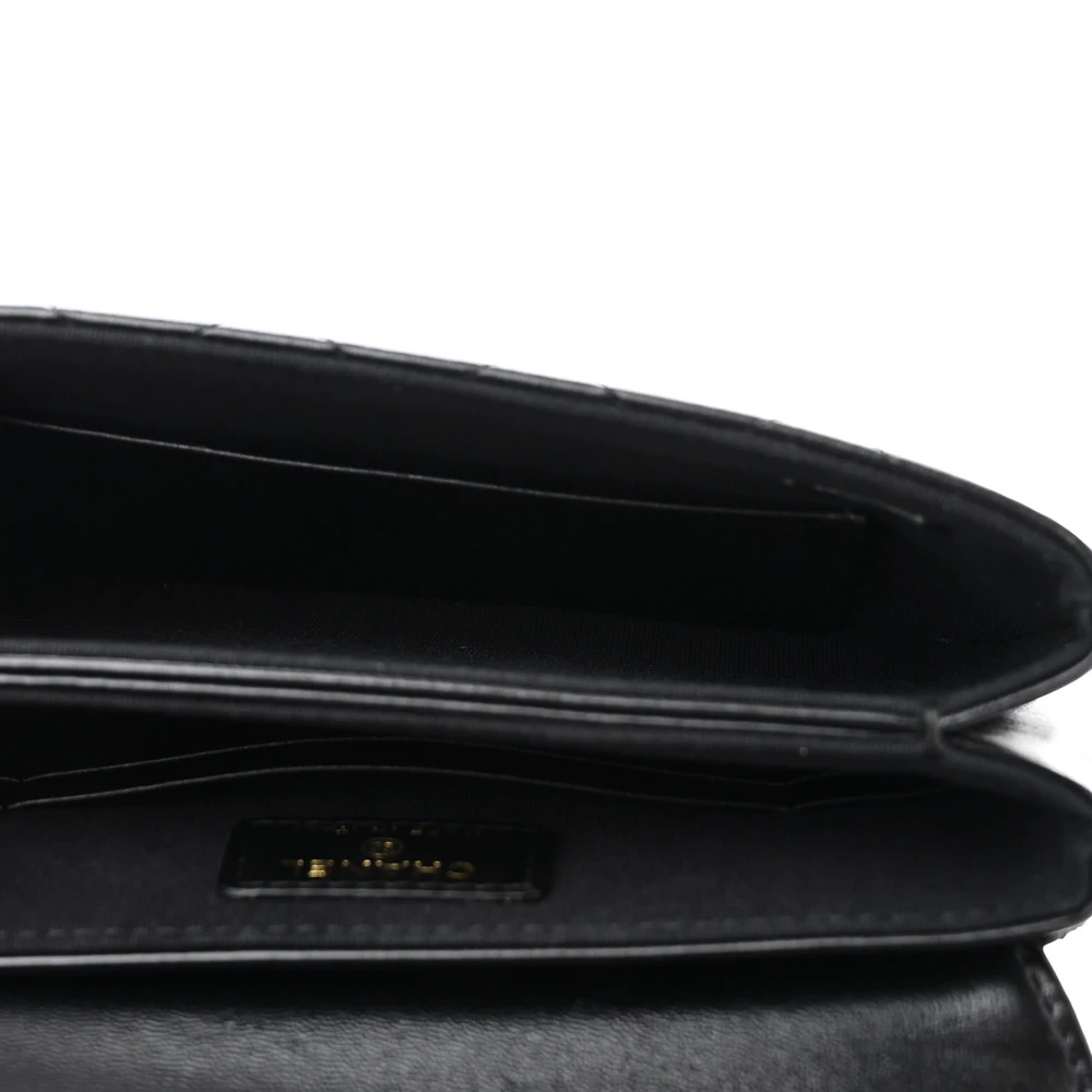 Interior view of the black Ch@nel Flap Phone Holder showing card slots and a zipper pocket