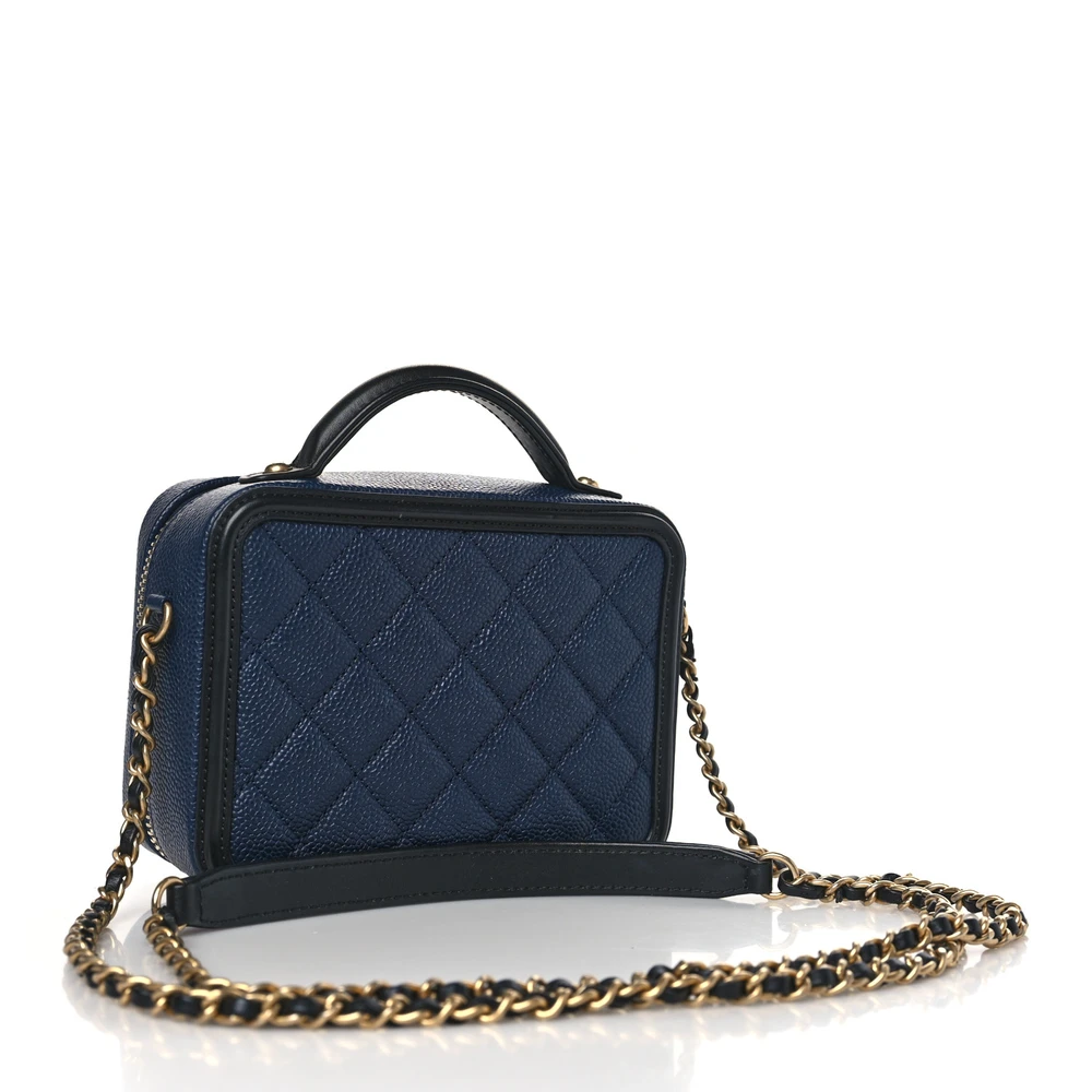 Back view of the navy Ch@nel Filigree Vanity Case with luxurious gold-tone chain strap