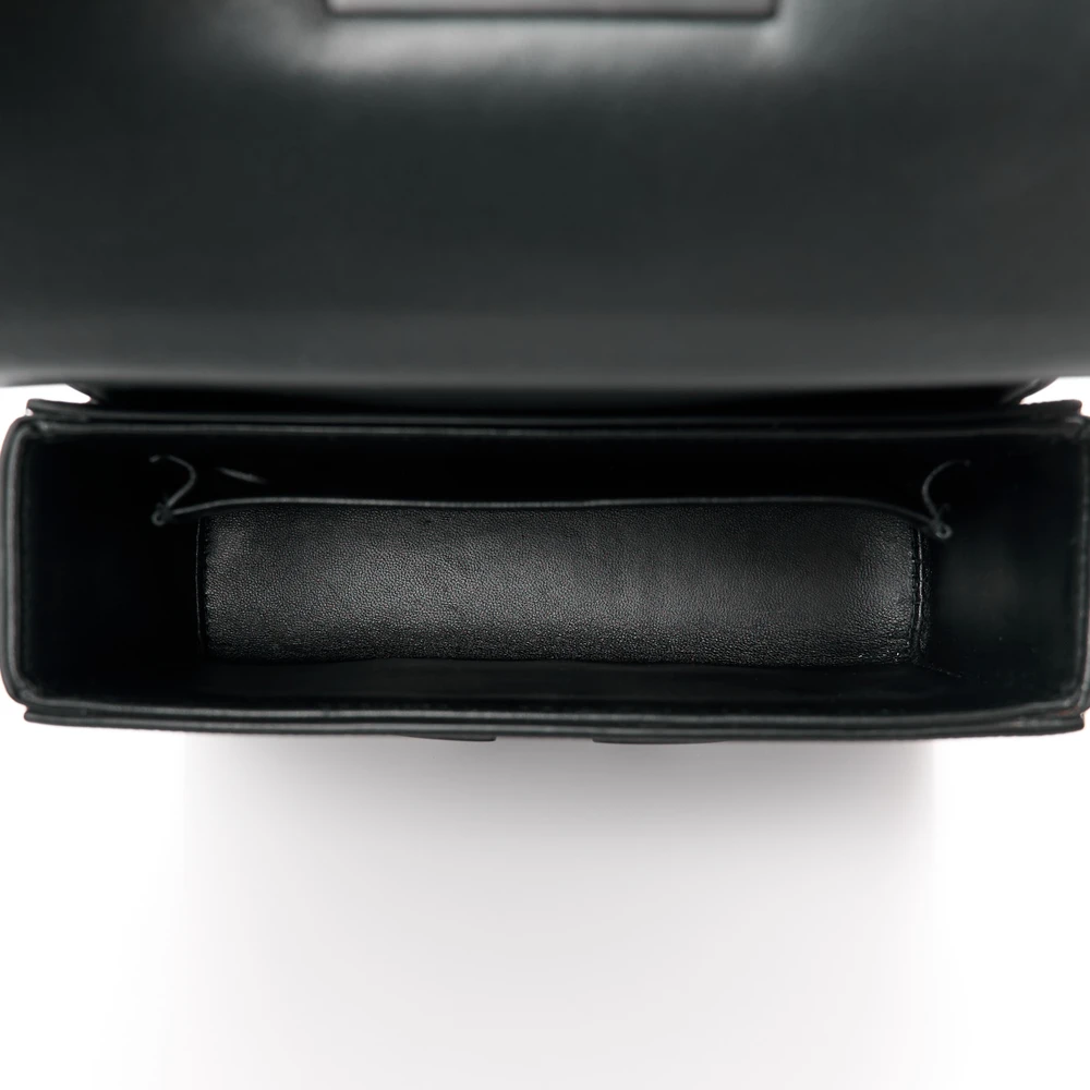 Interior view of the black D!0r 30 Montaigne Box Bag with its main compartment