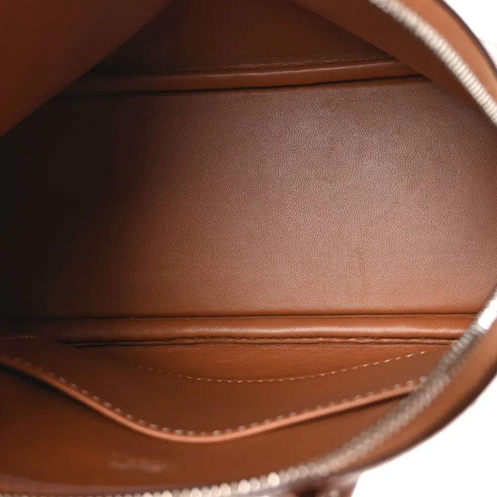 Interior view of the brown Evercolor Herme$ Mini 1923 Bolide with organised storage