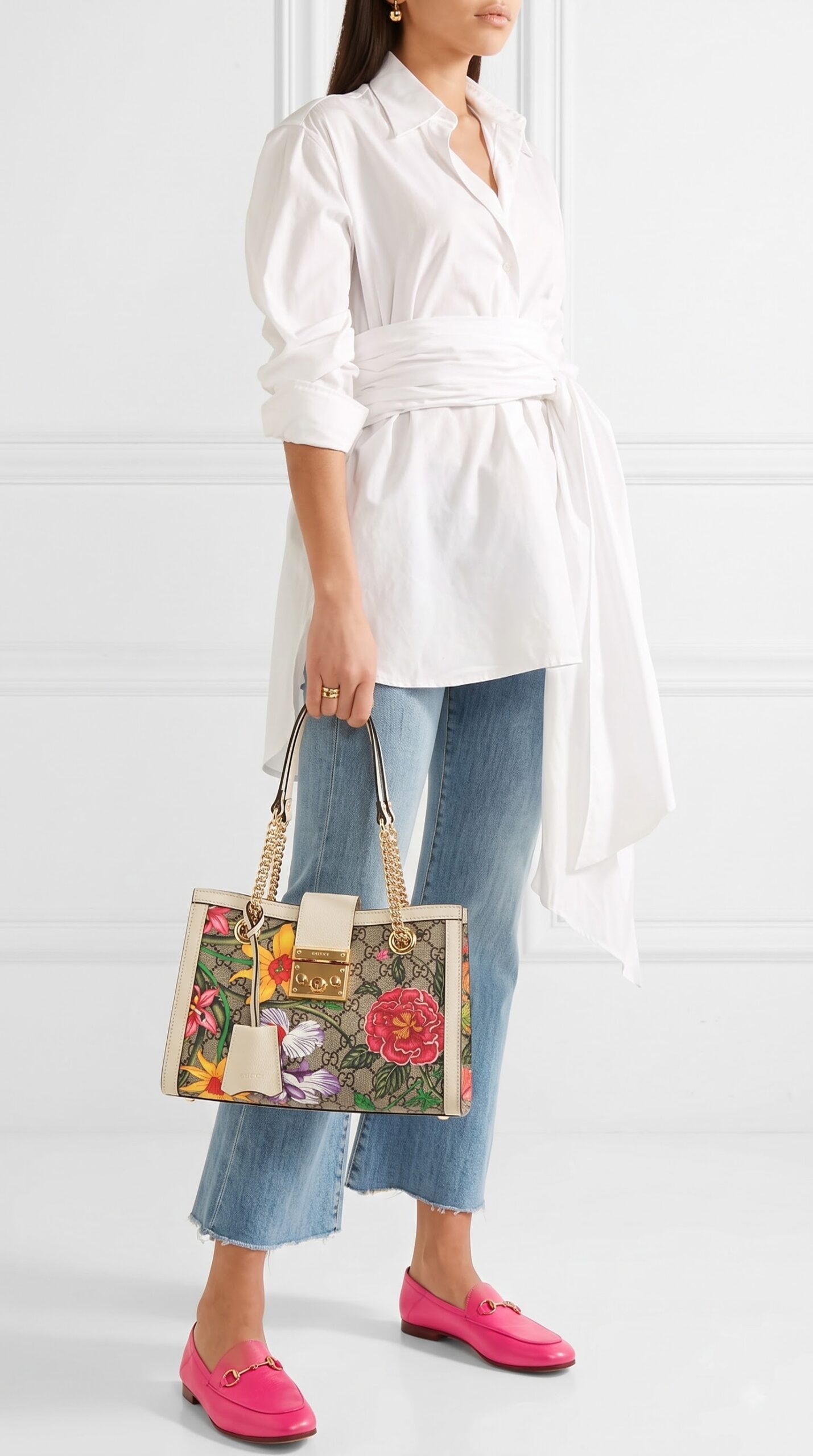 Model carrying the beige and multicolour Gucc! Flora Padlock Tote