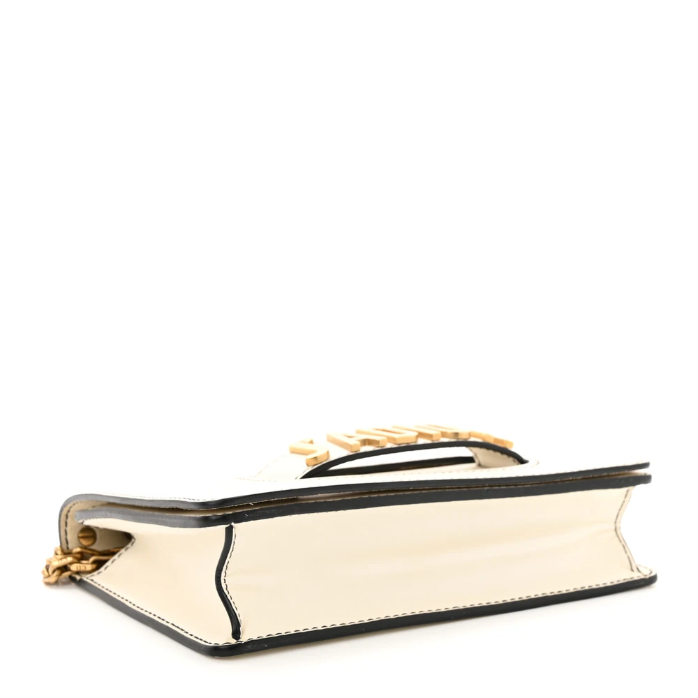 Bottom view of the off-white D!0r J’Adior Chain Flap Bag with gold-tone J’Adior detailing