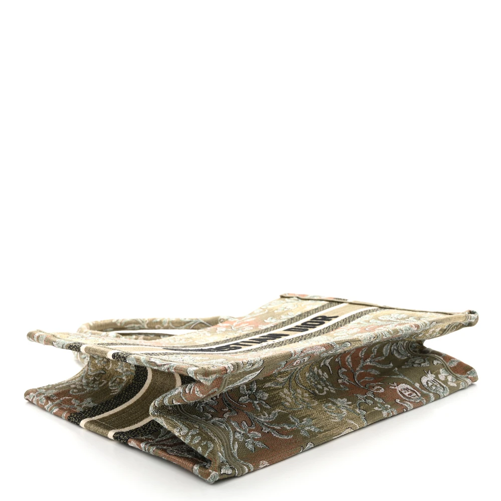 Bottom view of the metallic green D!0r Medium Book Tote with embroidered Dior PARIS signature