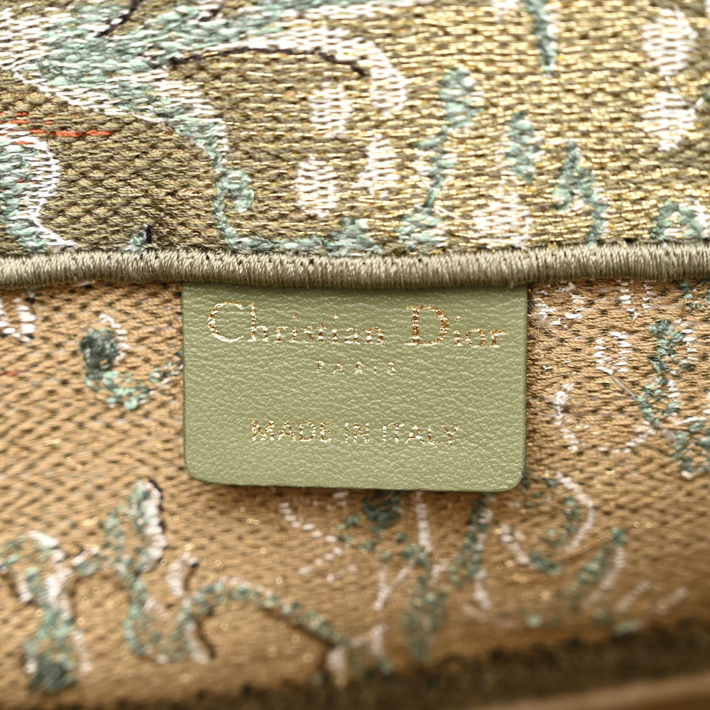 Close-up of Dior PARIS signature and intricate Brocart embroidery on the green Book Tote