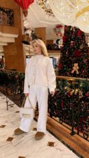 Model wearing the off-white D!0r J’Adior Chain Flap Bag over the shoulder