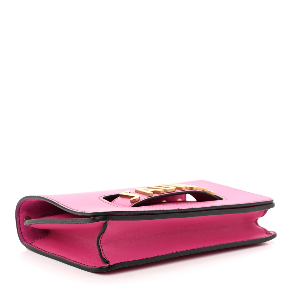 Bottom view of the fuchsia D!0r J’Adior Chain Flap Bag with signature logo on the flap