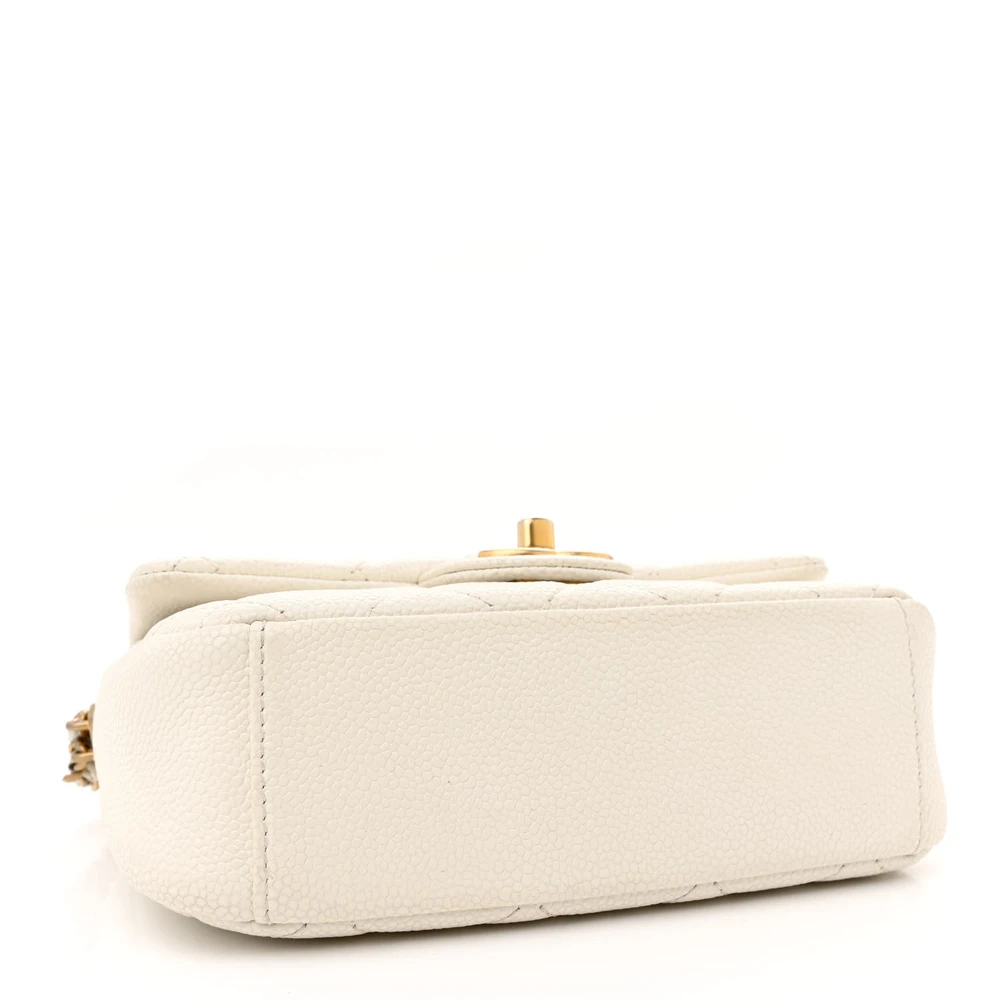 Bottom view of the white Ch@nel Mini Chain Soul Flap bag with gold-tone hardware