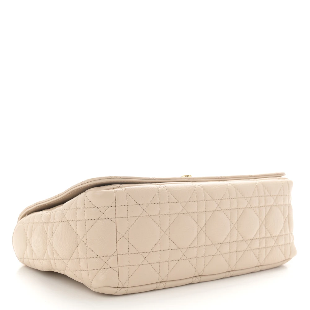 Bottom view of the beige D!0r Caro shoulder bag with Cannage stitching