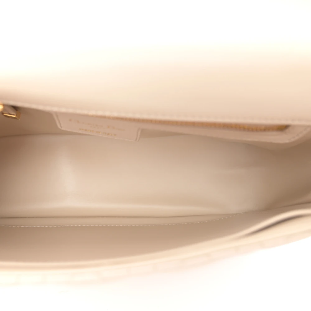 Suede interior of the beige D!0r Caro bag with zip and patch pockets
