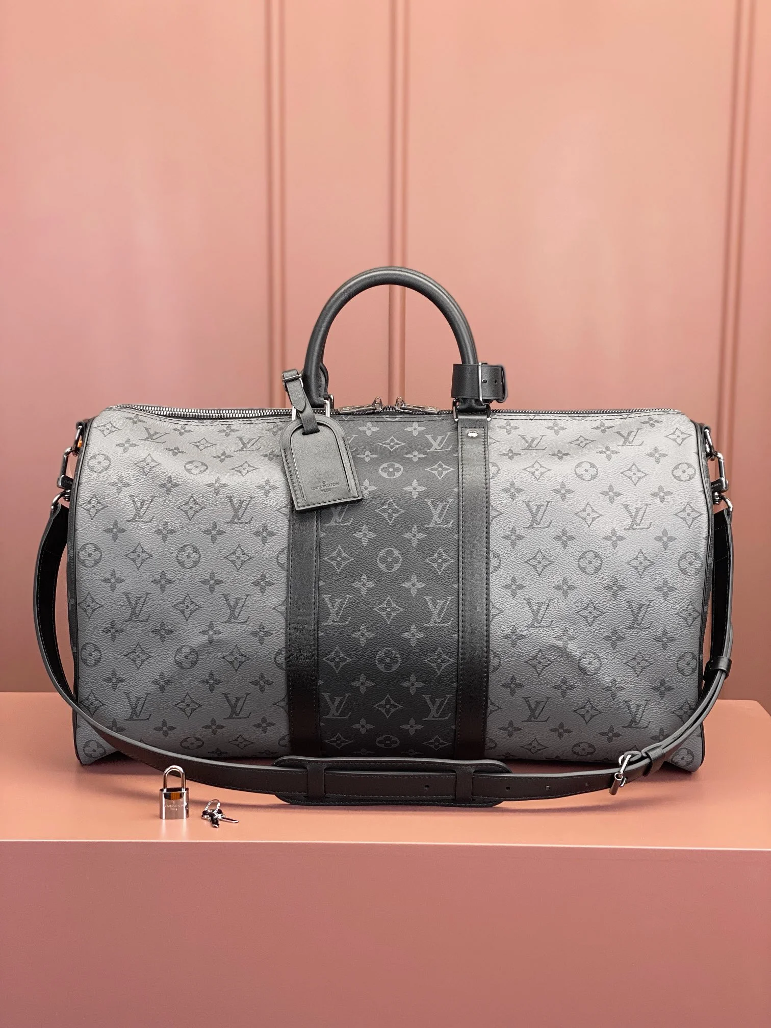 Front view of the Lou!S Vuiton Keepall Bandoulière 50 in alternating dark and light grey Monogram Eclipse canvas