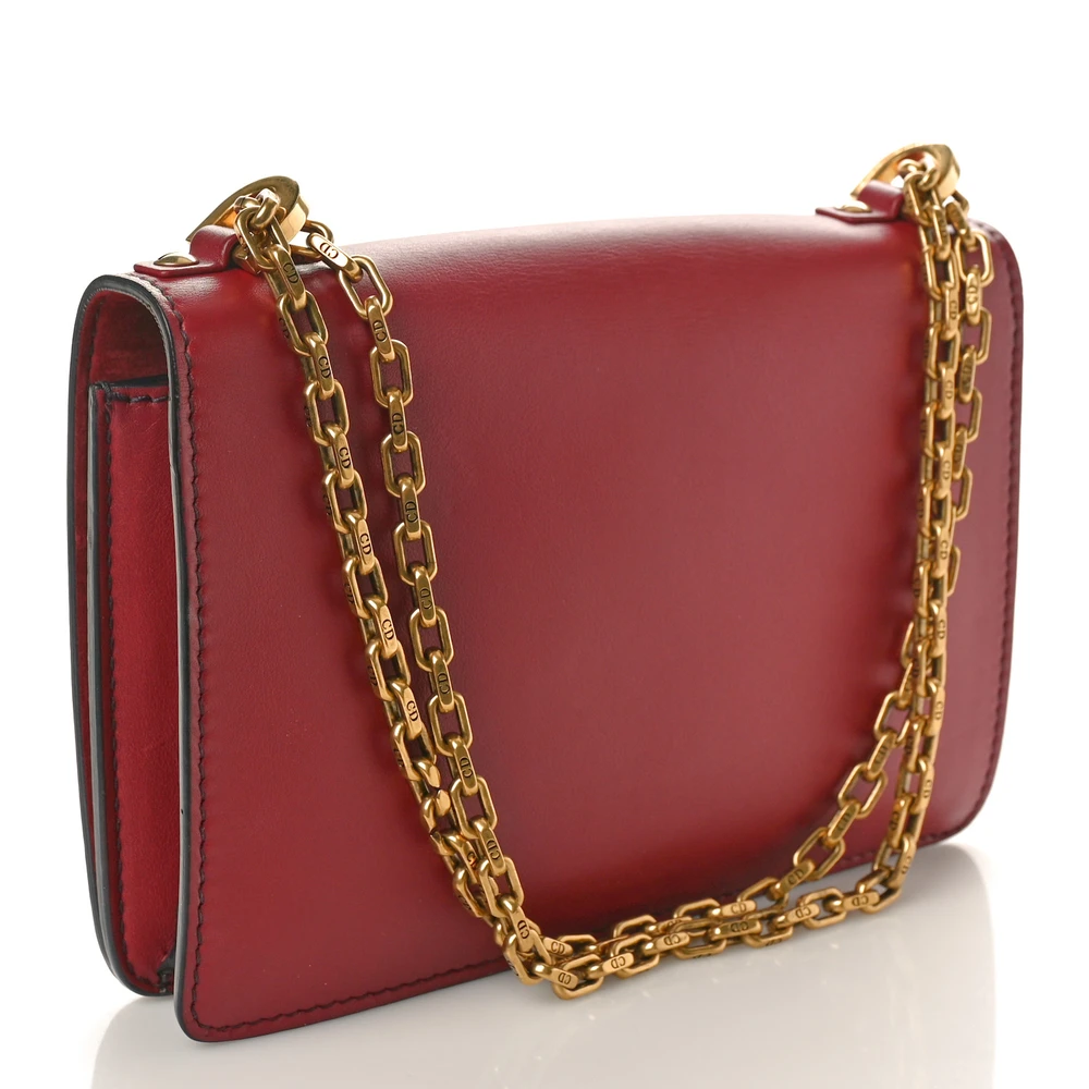 Back view of the red D!0r J’Adior Chain Flap Bag with gold-tone J’ADIOR signature